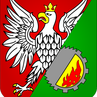 Herb Wołomina z białym orłem na czerwono-zielonym tle.